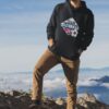 pullover hoodie mockup featuring a man at the top of a mountain 3048