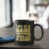 Futbalovy hrncek Life Is a Game Football Is Serious na stole